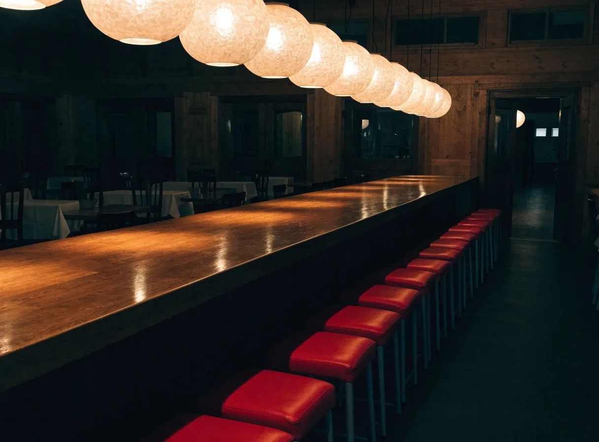 Dining counter with stools under warm light