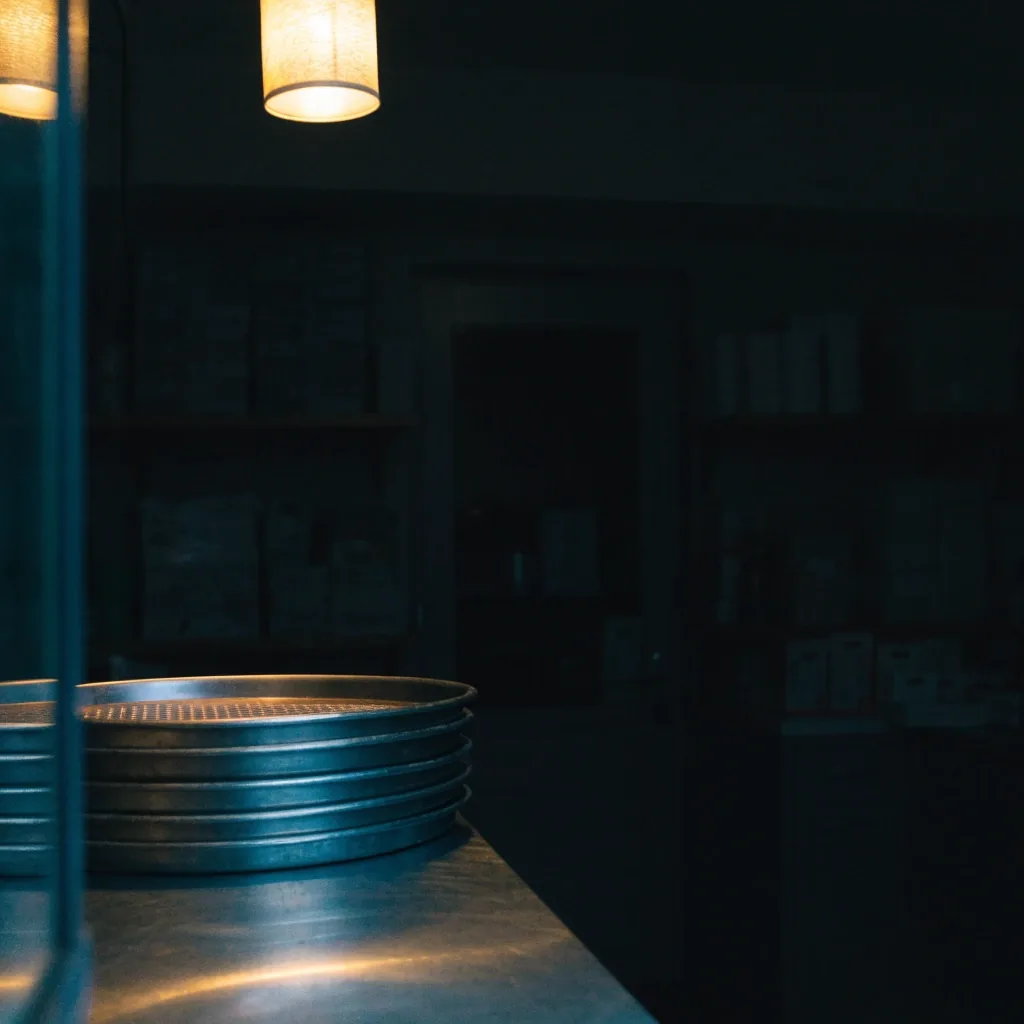 Quiet pizzeria counter at night